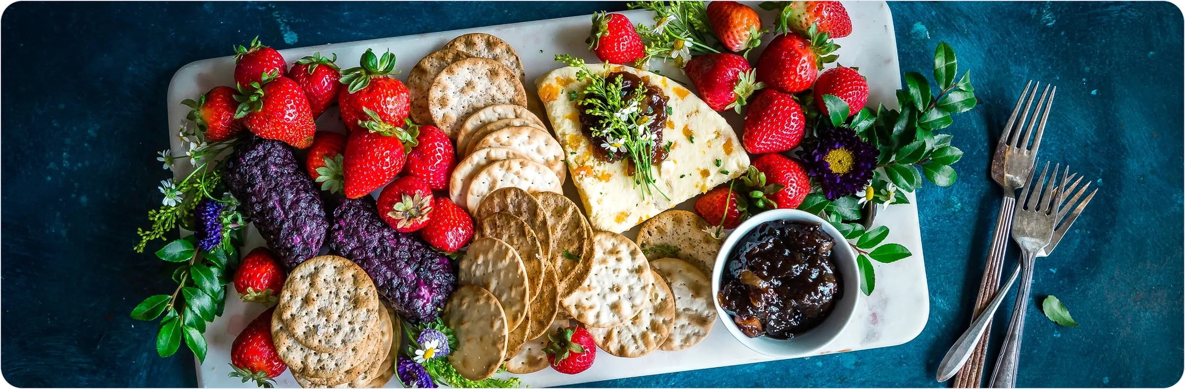 Platter of strawberries, crackers and cheese